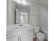 Well-lit bathroom with modern fixtures, vanity, and combined shower and bathtub at 2617 Chert Ln, Raleigh, NC 27610