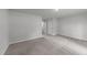 Spacious bedroom with neutral carpet and a double-door closet entrance at 2617 Chert Ln, Raleigh, NC 27610