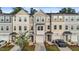 Attractive townhomes in neutral colors featuring attached garages and well maintained landscaping at 2617 Chert Ln, Raleigh, NC 27610