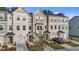 Attractive townhomes in neutral colors featuring attached garages and well maintained landscaping at 2617 Chert Ln, Raleigh, NC 27610