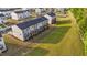 New construction townhomes with wooden decks and open green space in a modern planned community at 2617 Chert Ln, Raleigh, NC 27610