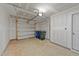 Spacious garage with an automatic garage door and concrete flooring at 2617 Chert Ln, Raleigh, NC 27610