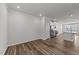 Open concept living room with an eat-in kitchen featuring modern appliances and sleek countertops at 2617 Chert Ln, Raleigh, NC 27610
