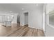 Bright and airy living room with stylish hardwood floors and stairs to the next level at 2617 Chert Ln, Raleigh, NC 27610