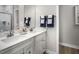 Modern bathroom featuring double vanity sinks with a quartz countertop and sleek fixtures at 2881 Foster Woods Dr, Apex, NC 27502