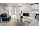 Inviting living room with soft seating, a mirrored coffee table, and a calming color scheme for relaxation at 2881 Foster Woods Dr, Apex, NC 27502