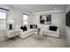 Bright living room showcasing a neutral color palette, large sectional, and stylish decor at 2881 Foster Woods Dr, Apex, NC 27502