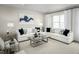 Bright and airy living room featuring neutral decor, modern furnishings, and lots of natural light at 2881 Foster Woods Dr, Apex, NC 27502