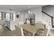Bright kitchen and dining area featuring open layout, modern appliances, and stylish furniture at 2885 Foster Woods Dr, Apex, NC 27502