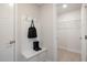 Practical mudroom with a storage bench, coat hooks, and easy access to a walk-in closet at 2889 Foster Woods Dr, Apex, NC 27502