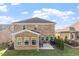 Brick home with a patio area featuring outdoor seating and a barbecue grill in the backyard at 330 Macallan Dr, Burlington, NC 27215