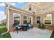 Cozy patio with outdoor seating, perfect for relaxing in the backyard of this brick home at 330 Macallan Dr, Burlington, NC 27215