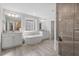 Bright bathroom with a soaking tub, double vanities, walk-in shower and tile flooring at 330 Macallan Dr, Burlington, NC 27215