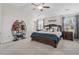 Spacious bedroom with dark wood furniture, ceiling fan, and two windows letting in ample sunlight at 330 Macallan Dr, Burlington, NC 27215