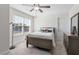 Bedroom with a full bed, ceiling fan, large window with blinds, and a chest of drawers at 330 Macallan Dr, Burlington, NC 27215