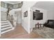 Spacious foyer with hardwood floors, staircase, and an open doorway to a living room at 330 Macallan Dr, Burlington, NC 27215