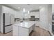Modern kitchen with white cabinets, granite countertops, and stainless steel appliances at 330 Macallan Dr, Burlington, NC 27215