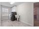 Laundry room with washer, dryer, utility sink, cabinet storage, window, and tile floors at 330 Macallan Dr, Burlington, NC 27215