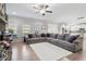 Spacious living room with a large sectional sofa, fireplace, and open access to the kitchen at 330 Macallan Dr, Burlington, NC 27215