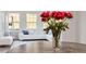 Cozy sunroom featuring large windows offering natural light, and comfortable white seating at 330 Macallan Dr, Burlington, NC 27215