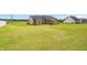 Large backyard showcasing the home's exterior, patio, and ample green space at 3345 Little Creek Church Rd, Clayton, NC 27520