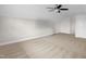 Bright, carpeted bedroom with a ceiling fan and access door at 3345 Little Creek Church Rd, Clayton, NC 27520