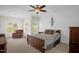 Comfortable bedroom with natural light, decorative trim, and a cozy sitting area at 3345 Little Creek Church Rd, Clayton, NC 27520