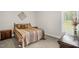 Cozy bedroom with warm tones, a comfortable bed, and side tables at 3345 Little Creek Church Rd, Clayton, NC 27520
