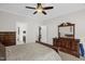 Well-appointed bedroom with wood furniture and an en-suite bathroom at 3345 Little Creek Church Rd, Clayton, NC 27520