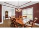Traditional dining room with hardwood floors, chandelier, and decorative molding at 3345 Little Creek Church Rd, Clayton, NC 27520