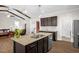 Spacious kitchen with a central island, stainless steel appliances, and hardwood floors at 3345 Little Creek Church Rd, Clayton, NC 27520