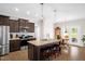 Open kitchen with island seating, stainless steel appliances, and granite countertops at 3345 Little Creek Church Rd, Clayton, NC 27520