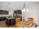 Bright kitchen and dining area with island seating and modern light fixtures at 3345 Little Creek Church Rd, Clayton, NC 27520