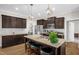 Modern kitchen featuring granite countertops, stainless steel appliances, and pendant lighting at 3345 Little Creek Church Rd, Clayton, NC 27520