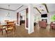 Open floor plan with hardwood floors seamlessly connects living and dining spaces at 3345 Little Creek Church Rd, Clayton, NC 27520