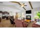Inviting living room with vaulted ceiling, exposed beams, and a cozy fireplace at 3345 Little Creek Church Rd, Clayton, NC 27520