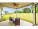 Relaxing covered patio with outdoor seating and view of the expansive backyard at 3345 Little Creek Church Rd, Clayton, NC 27520