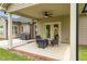 Cozy covered patio, perfect for outdoor gatherings with views of landscaped backyard and grill at 3345 Little Creek Church Rd, Clayton, NC 27520