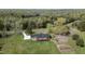 Stunning aerial view of the home, showcasing the expansive lawn and mature trees at 3540 Sellars Rd, Mebane, NC 27302