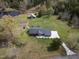 Aerial shot of the property with expansive yard, mature trees, and driveway at 3540 Sellars Rd, Mebane, NC 27302