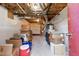 A spacious basement area with exposed ceiling and neatly stored belongings at 3540 Sellars Rd, Mebane, NC 27302