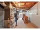 Basement area with visible ceiling insulation and ductwork, offering potential storage or utility space at 3540 Sellars Rd, Mebane, NC 27302