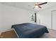 A comfy bedroom with a ceiling fan and carpet, complemented by natural light from the window at 3540 Sellars Rd, Mebane, NC 27302