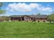 Charming brick home with well-maintained front yard and a metal roof at 3540 Sellars Rd, Mebane, NC 27302