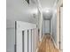 Bright hallway featuring wood floors and neutral wall colors at 3540 Sellars Rd, Mebane, NC 27302