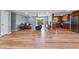Spacious living room featuring wood floors, modern lighting, and open layout at 3540 Sellars Rd, Mebane, NC 27302