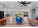 Inviting living room with wood floors, large windows, and a stylish seating area at 3540 Sellars Rd, Mebane, NC 27302