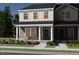 Charming two-story home with a welcoming porch and tasteful gray and white exterior paint at 3714 Rosebush Dr, Zebulon, NC 27597