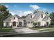 Inviting traditional home features a three-car garage, a manicured lawn, and neutral brick at 4002 Dublin Ct, Burlington, NC 27215