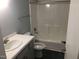 Bathroom featuring a sink vanity, tile flooring, toilet, and a shower-tub combination at 405 Starrett Ct, Raleigh, NC 27603
